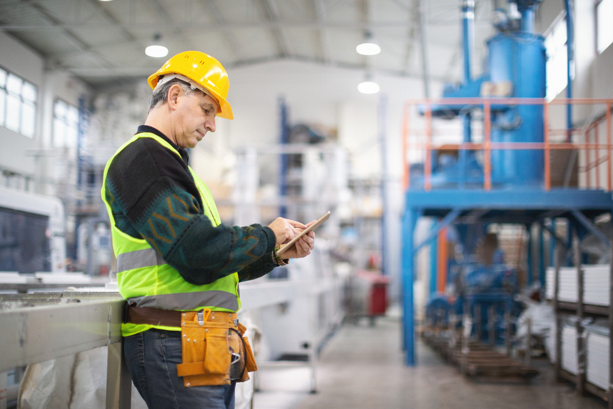 Portrait of senior manager in factory